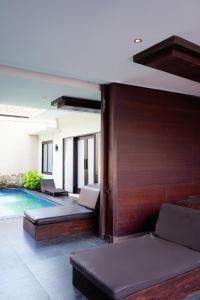 a living room with a swimming pool in a house at Buana Bali Villas & Spa in Jimbaran +54 photos
