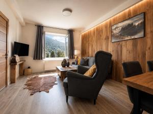 a living room with a couch and a table at Apartmány Panorama Harrachov in Harrachov