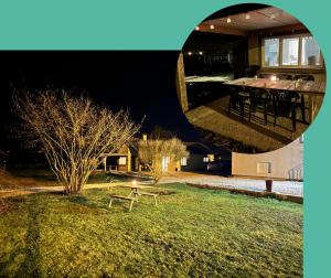 a view of a house with a table in the yard at Cocon à la ferme - Lac du Der in Loisy-sur-Marne
