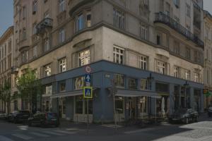 a building on a street with cars parked in front of it at TWENTYSEVEN Boutique in Budapest