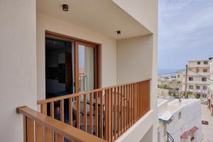 a balcony with a view of the city at Agia Triada Suites in Heraklio