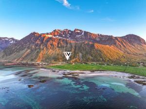 an aerial view of a mountain with the v sign on it at Villa Walter Lofoten with SAUNA in Kvalnes