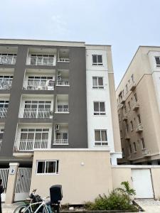 a bicycle parked in front of a building at Waterfront 3BR Lekki Lagoon View in Maiyegun