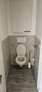 a small bathroom with a toilet in a stall at cosy studio in Saint-Maximin-la-Sainte-Baume