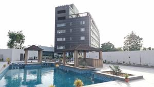 a rendering of a hotel with a swimming pool at THE PRIME PARK in Amrāvati