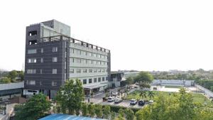 an aerial view of a building with a parking lot at THE PRIME PARK in Amrāvati