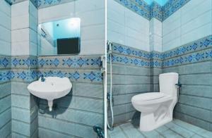 a bathroom with a toilet and a sink at Alliswell in Patna +5 photos
