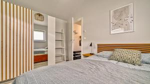 a bedroom with a bed with a wooden headboard at Domki Izerskie in Krobica
