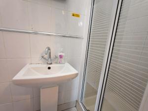 a bathroom with a sink and a shower at The Forest- Greenwood in Cambridge