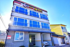 a store front with a sign on top of it at Sokcho otwohouse pension in Sokcho