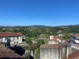 a view of a town with buildings and trees at Ático Seijas 6 in Tui