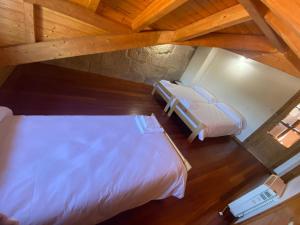 an overhead view of a bedroom with two beds at Ático Seijas 6 in Tui