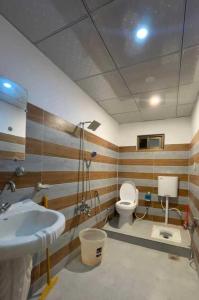 a bathroom with a sink and a toilet at EYE VIEW hotel skardu in Skardu