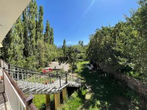 a view from a balcony of a garden with trees at EYE VIEW hotel skardu in Skardu