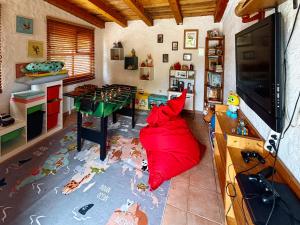 a room with a large red blanket on the floor at Villa Vika Apartments in Njivice