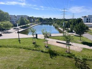 a view of a river with trees in a park at Kenny's place in Essen