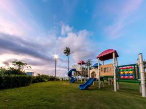 a park with a playground with slides at Saipan World Resort in Susupe