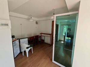 a living room with a table and a white chair at Koh kood Neverland beach resort in Ko Kood
