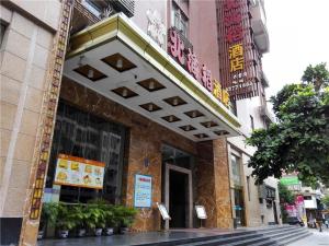 a building with a sign on the front of it at Behito Hotel in Dongguan
