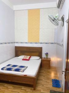 a bedroom with a bed in a room at MyDungmotel in Danang