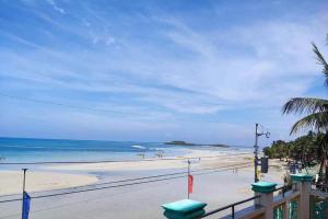 a view of a beach with the ocean at Pertible Beach Resort in Tondol