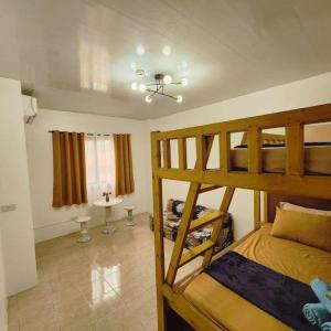 a bedroom with two bunk beds in a room at Pertible Beach Resort in Tondol +63 photos
