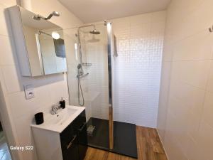 a bathroom with a shower and a sink at Pokoje Roztoki 4a in Rabka-Zdrój