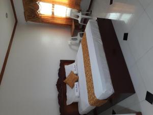 an overhead view of a bed in a room at Andres Resort in Nabas