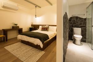 Letto o letti in una camera di Haku Beach Days Inn