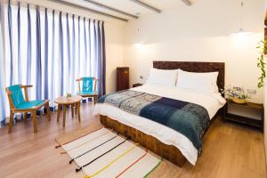Letto o letti in una camera di Haku Beach Days Inn