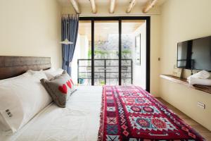 Letto o letti in una camera di Haku Beach Days Inn