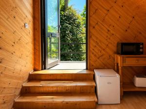 an empty room with a window and a refrigerator at Relaxing Loft Getaway Heart of County Meath in Enfield