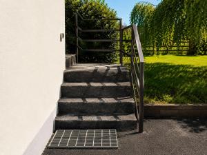 a set of stairs leading up to a house at Relaxing Loft Getaway Heart of County Meath in Enfield