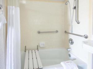 a white bath tub in a bathroom with a shower at Days Inn by Wyndham Eureka CA in Eureka +30 photos