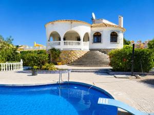 a house with a swimming pool in front of it at Private Pool Villa La Siesta in La Mata