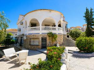 a building with a balcony on top of it at Private Pool Villa La Siesta in La Mata