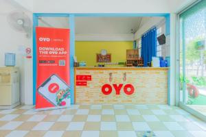 an open door into a kitchen with an oo sign at Koh Lak Resort in Prachuap Khiri Khan