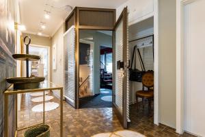 a hallway of a home with a mirror and a table at Ferienwohnungen Lemma in Möhnesee +57 photos