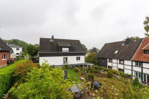 a group of white houses in a village at Ferienwohnungen Lemma in Möhnesee