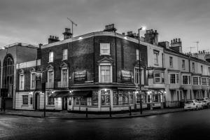 a black and white photo of a building on a street at Starboard Stays in Southampton