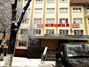 a building with a sign on the front of it at Nirvana in Rivne