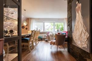 a living room and dining room with a table and chairs at Ferienwohnungen Lemma in Möhnesee