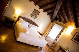 Postel nebo postele na pokoji v ubytování Relaisfranciacorta