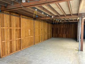 a large garage with wooden panels on the wall at Residence Oude Haven room with terrace in Colijnsplaat +44 photos