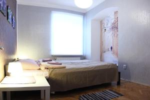 Ліжко або ліжка в номері Comfortable apartament in the centr