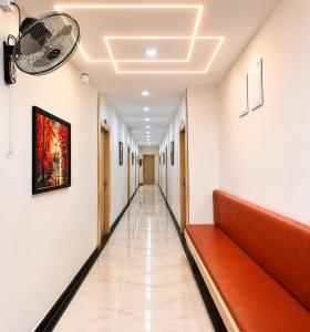 an empty corridor of a hospital with a corridor at Hotel Narsingi in Gundipet