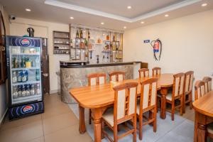 a dining room with a table and a refrigerator at Hotel AB Inn in Kathmandu
