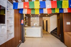 a hallway with colorful flags hanging from the ceiling at Hotel AB Inn in Kathmandu
