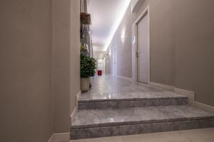 an empty hallway with stairs in a building at Cinque Terre Gateway in La Spezia