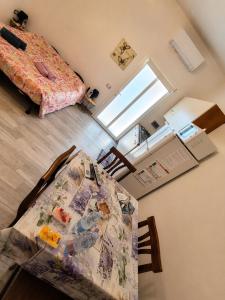 a view of a bedroom with a bed and a table at Stella Marys Nord in Olbia